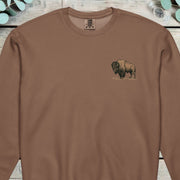 Small design of an American bison standing side on
