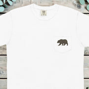 Small grizzly bear printed on the chest pocket of a t-shirt