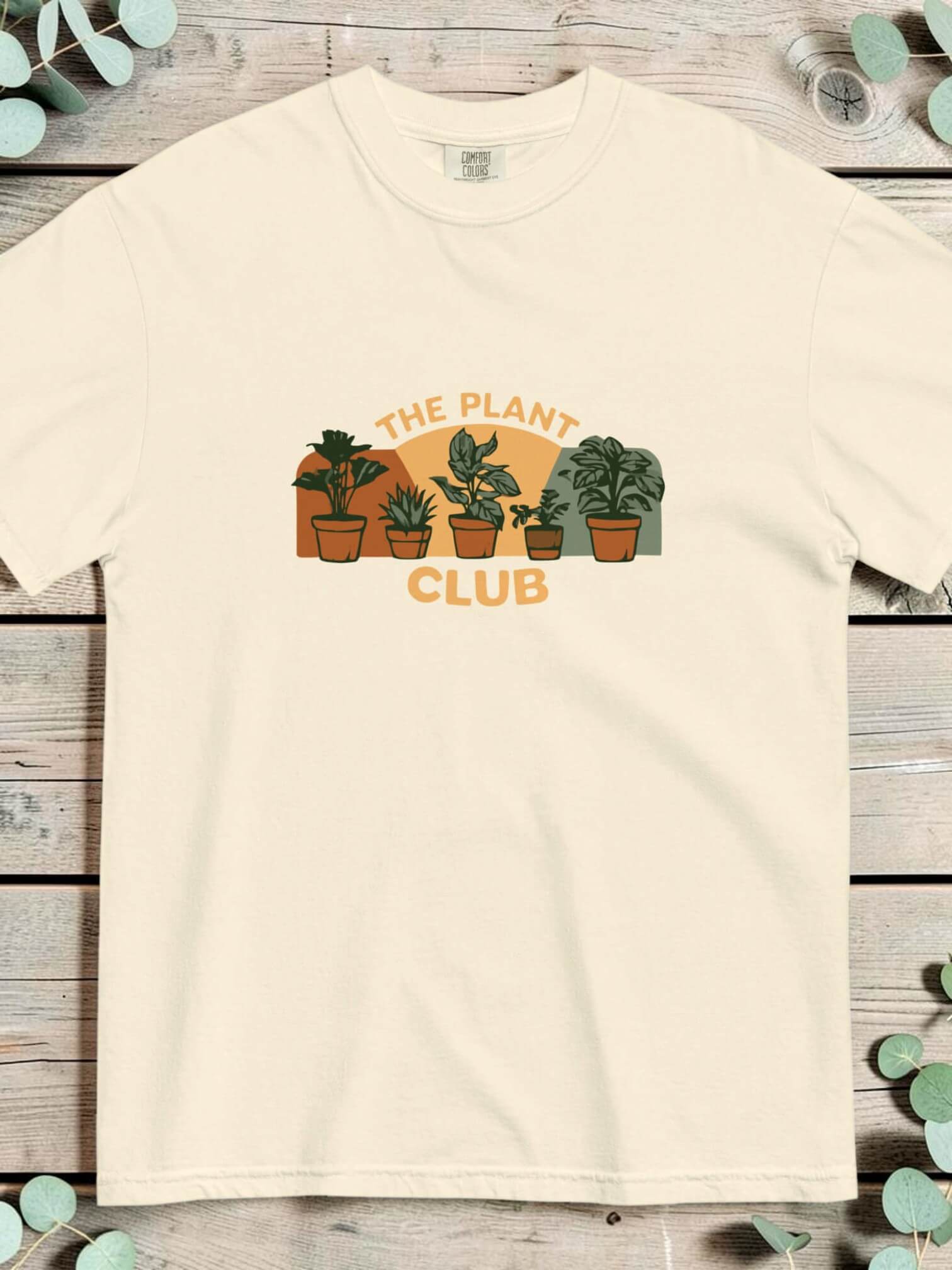 The Plant Club houseplants design on an Ivory garment-dyed cotton t-shirt