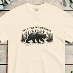 Bear and pine forest wilderness design on an Ivory garment-dyed cotton t-shirt