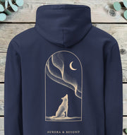 Back print of a white wolf howling beneath the northern lights inside an arched frame