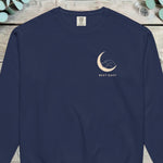Small design of a fox curled asleep inside a crescent moon above the words REST EASY