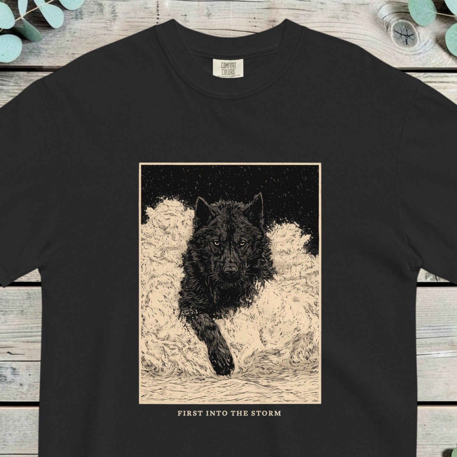 Black wolf pushing through deep snow inside a framed vintage plate