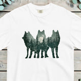 Three wolf silhouettes filled with a moonlit pine forest in a double exposure design