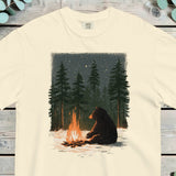 Black bear sitting beside a campfire in snowy pine woods under a starry sky