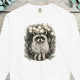 Raccoon peering out from inside a pine wreath strung with small lights