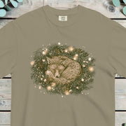 Fox curled up asleep inside a pine wreath strung with small warm lights