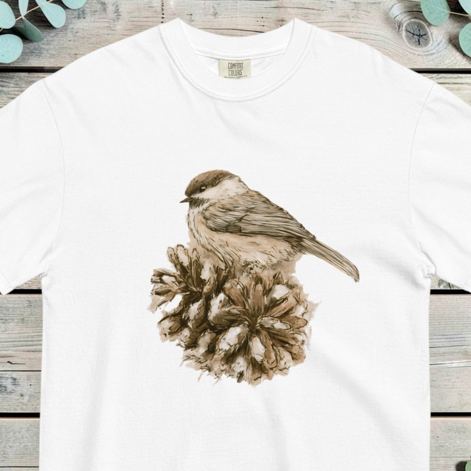 Small sparrow perched on an open pine cone, worked in soft sepia tones