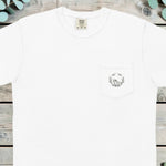 Small holly wreath with a frog printed on the chest pocket of a t-shirt
