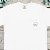 Small holly wreath with a frog printed on the chest pocket of a t-shirt