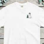 Small chest design of a top-hatted snowman standing beside a pine tree