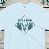 Stag head between two pine trees in a diamond frame with PINE AND SNOW above it