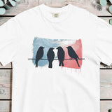 Birds on a wire design on a White garment-dyed cotton t-shirt
