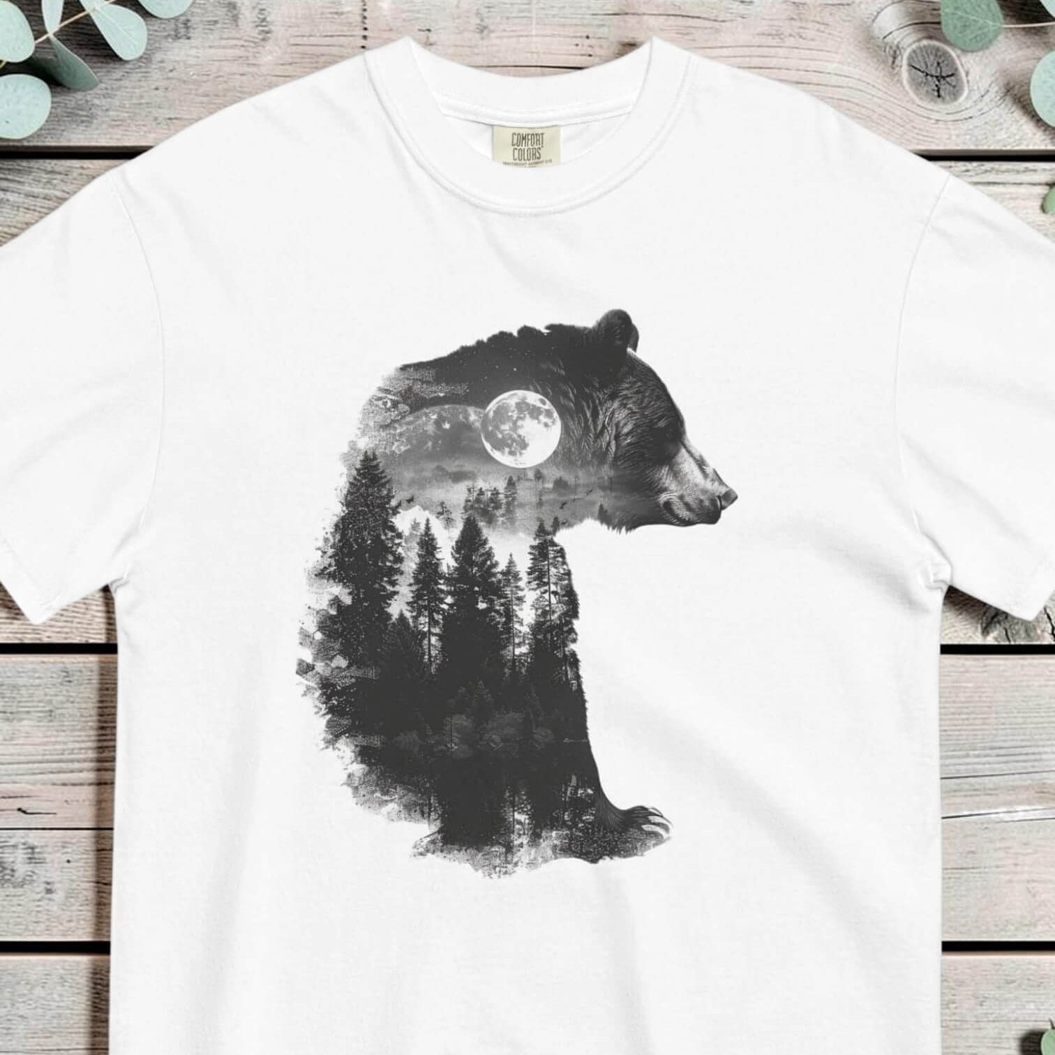 Bear and forest double exposure design on a White garment-dyed cotton t-shirt