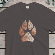 Large wolf paw print filled with topographic contour map lines in rust and terracotta