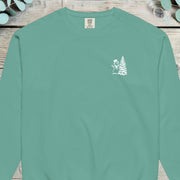 Small chest design of a top-hatted snowman beside a Christmas tree on a sweatshirt
