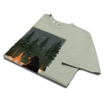 Black bear by a winter campfire design on a Bay garment-dyed cotton t-shirt