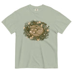 Fox asleep in a Christmas wreath design on a Bay garment-dyed cotton t-shirt