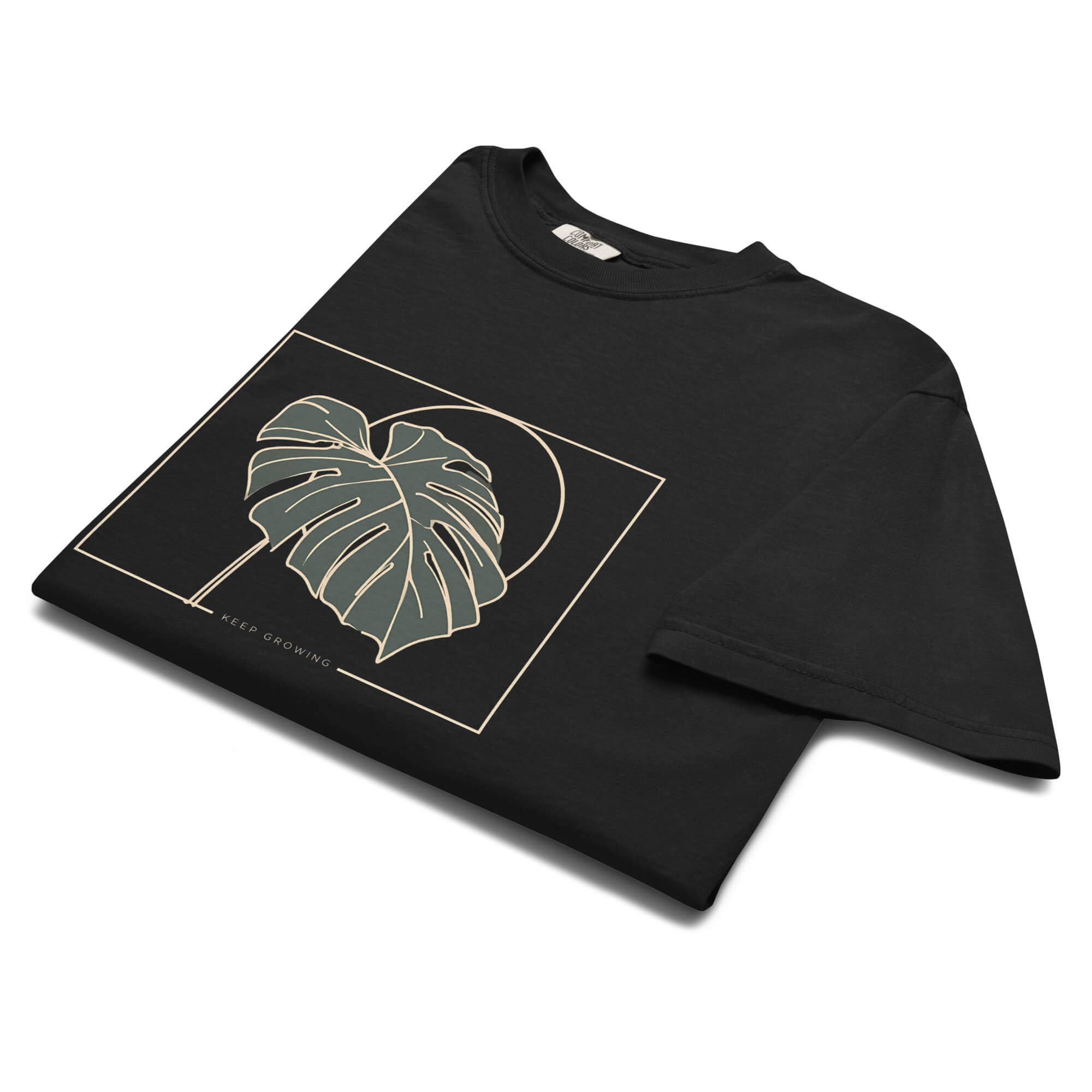 Monstera leaf design on a Black garment-dyed cotton t-shirt