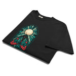 Moth in a stained glass window design on a Black garment-dyed cotton t-shirt