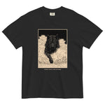 Black wolf in deep snow design on a Black garment-dyed cotton t-shirt