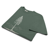 Pine tree and roots design on a Blue Spruce garment-dyed cotton t-shirt