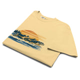 Wolf pack at sunset design on a Butter garment-dyed cotton t-shirt
