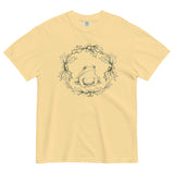 Frog in a holly wreath design on a Butter garment-dyed cotton t-shirt