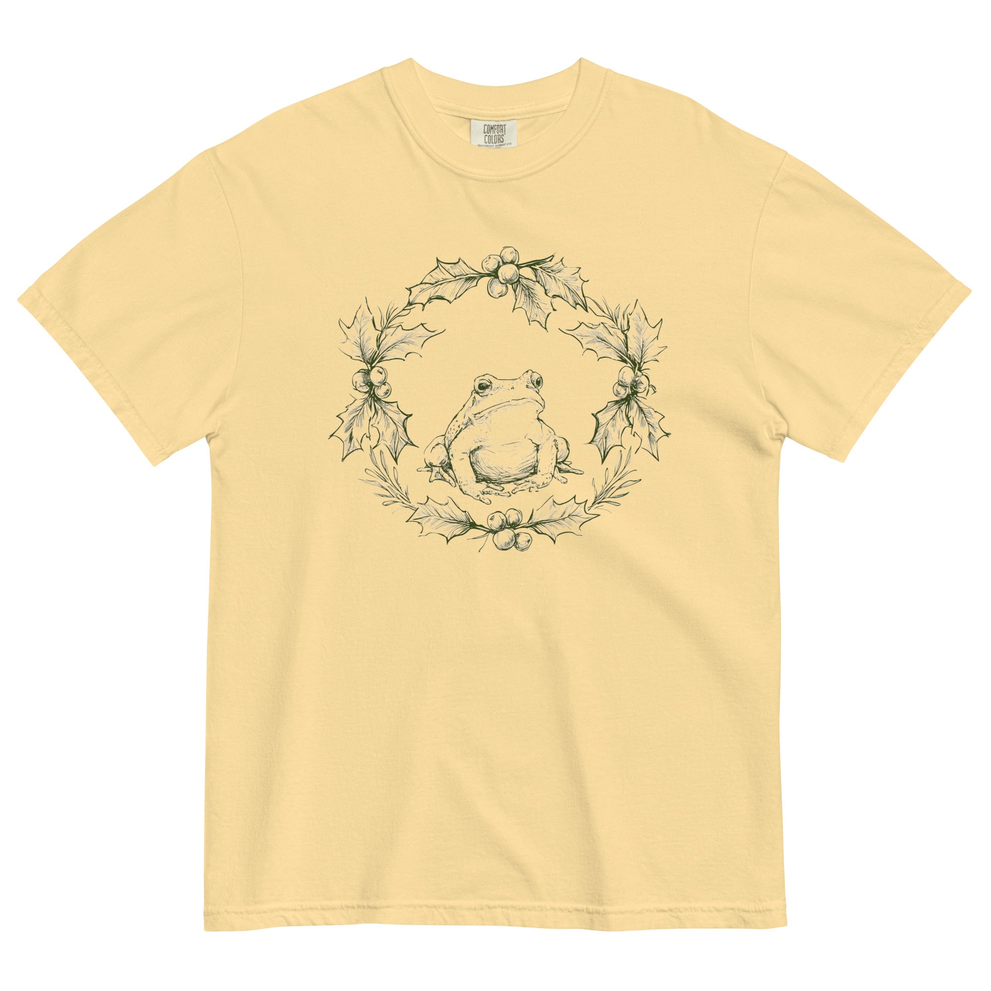 Frog in a holly wreath design on a Butter garment-dyed cotton t-shirt