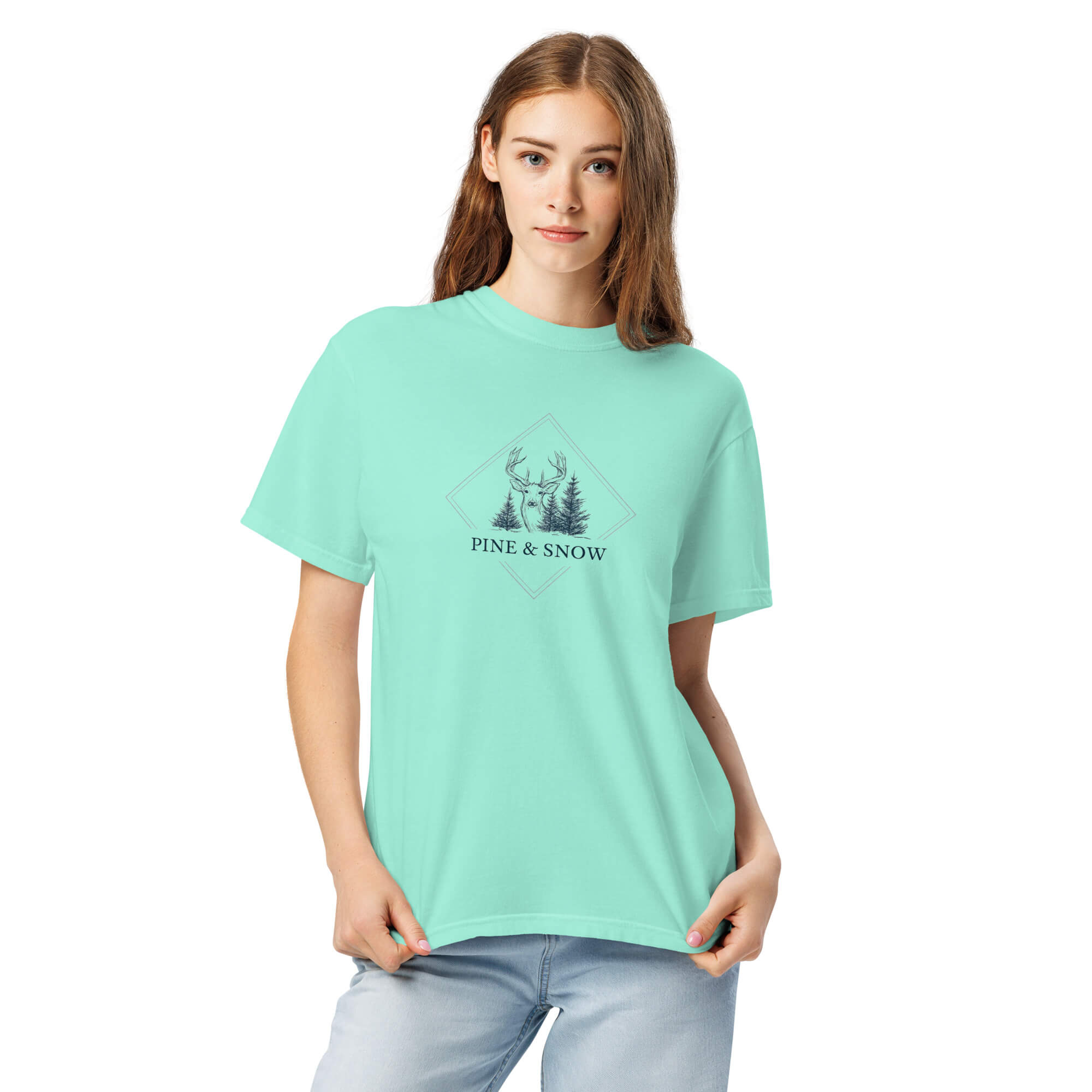 Deer and winter forest design on a Chalky Mint garment-dyed cotton t-shirt