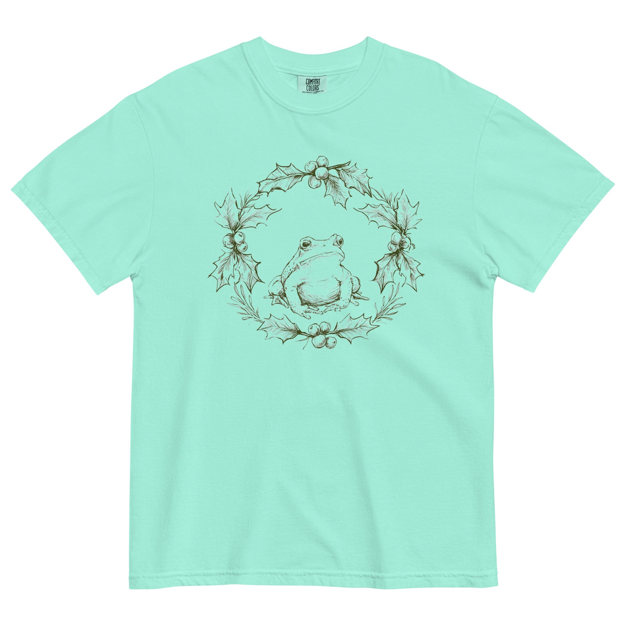 Frog in a holly wreath design on a Chalky Mint garment-dyed cotton t-shirt