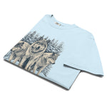 Three wolves in the snow design on a Chambray garment-dyed cotton t-shirt