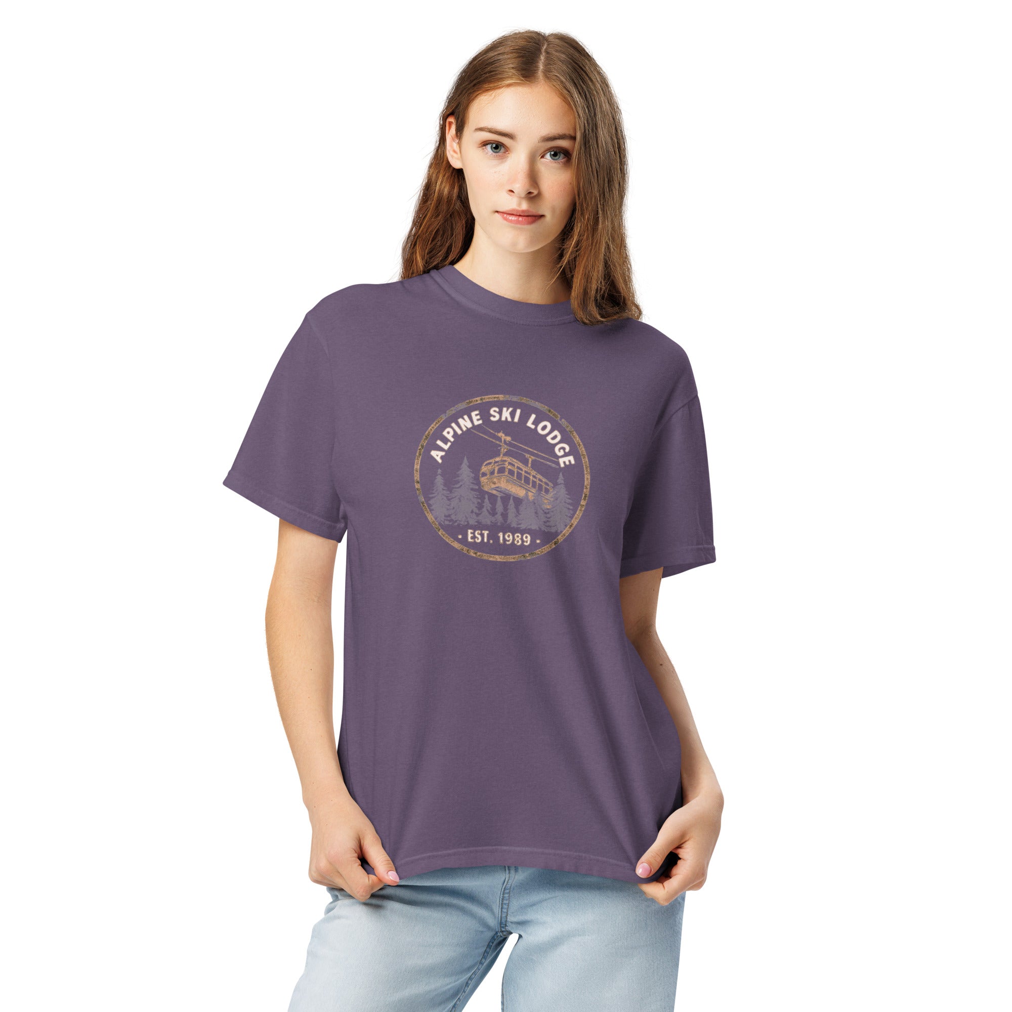 Alpine ski lodge gondola badge design on a Grape garment-dyed cotton t-shirt