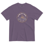 Alpine ski lodge gondola badge design on a Grape garment-dyed cotton t-shirt