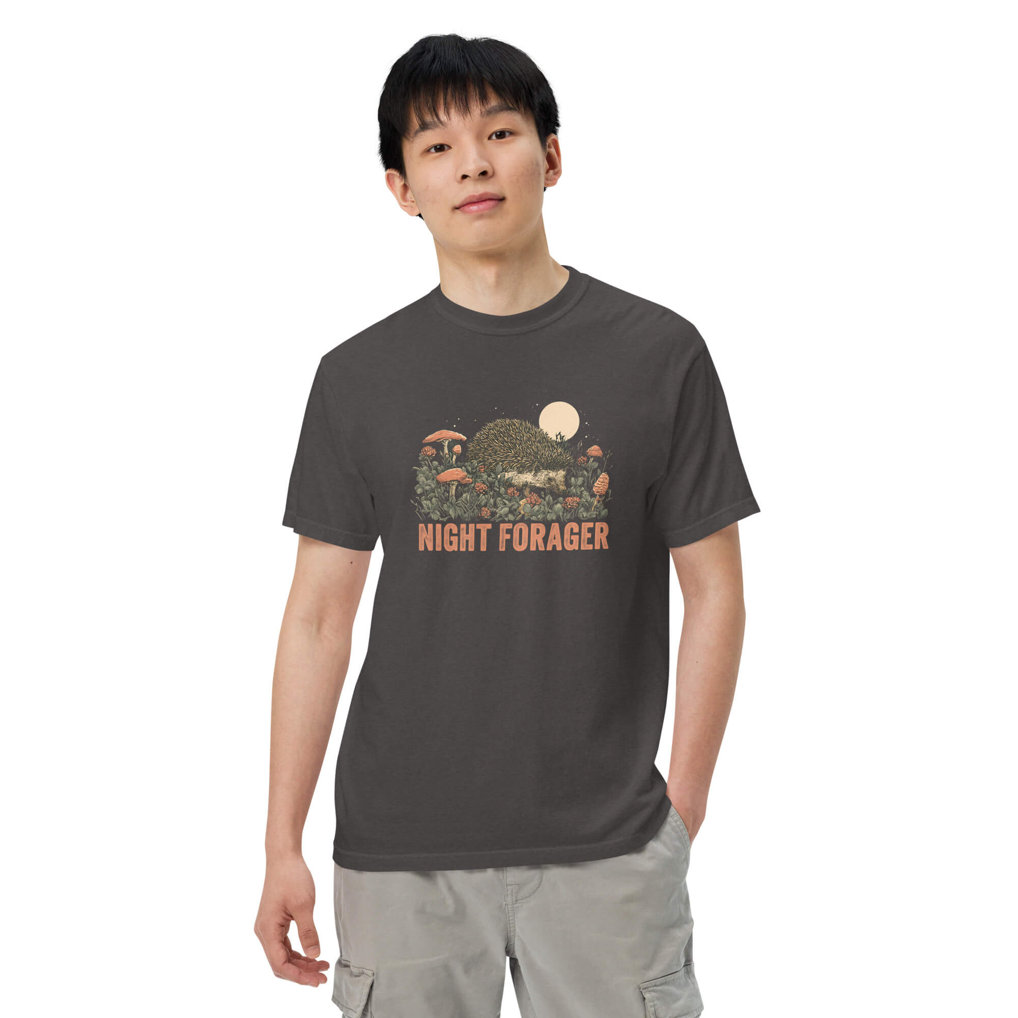 Hedgehog and mushrooms design on a Graphite garment-dyed cotton t-shirt