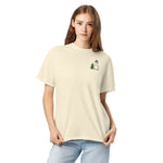 Snowman and pine tree design on an Ivory garment-dyed cotton t-shirt