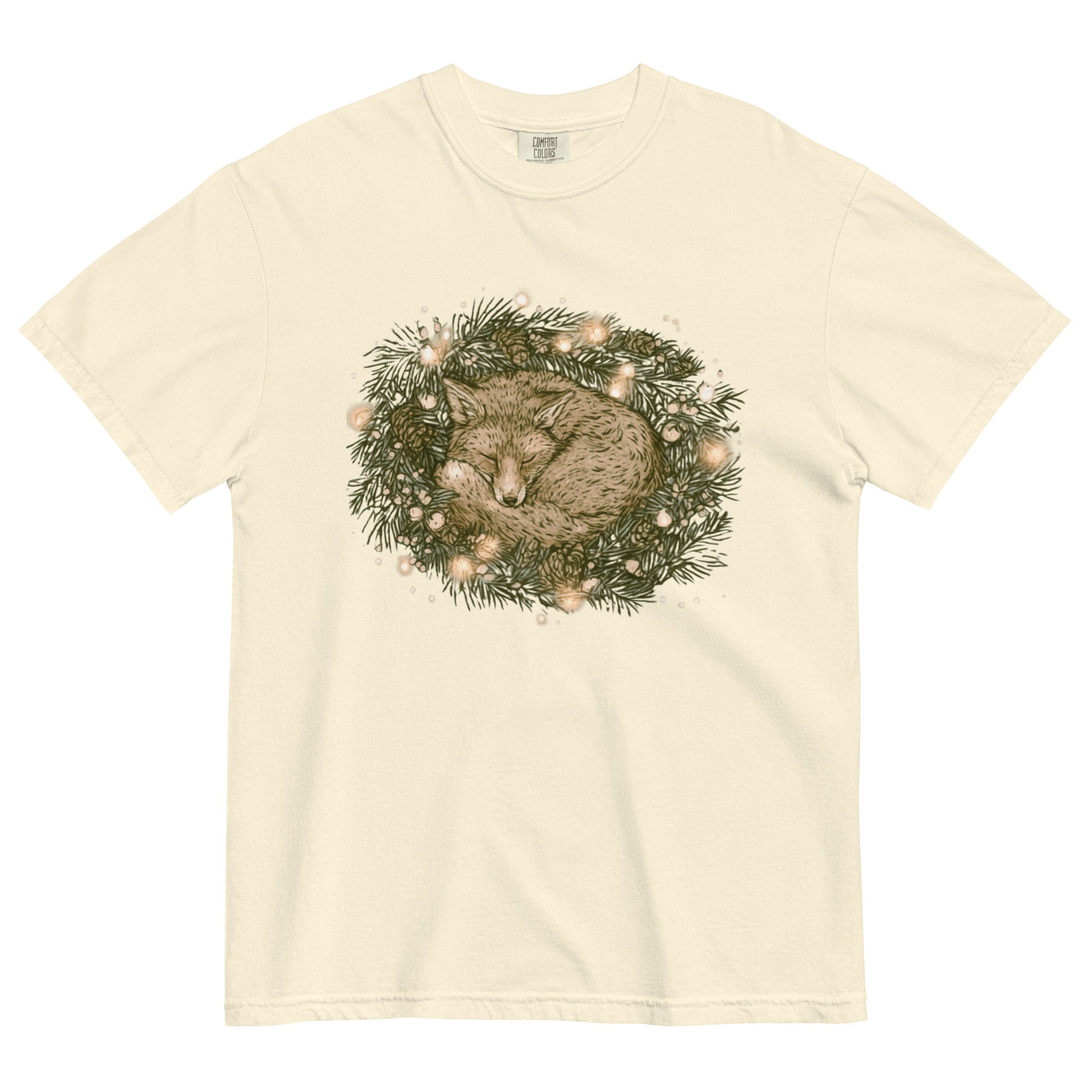 Fox asleep in a Christmas wreath design on an Ivory garment-dyed cotton t-shirt