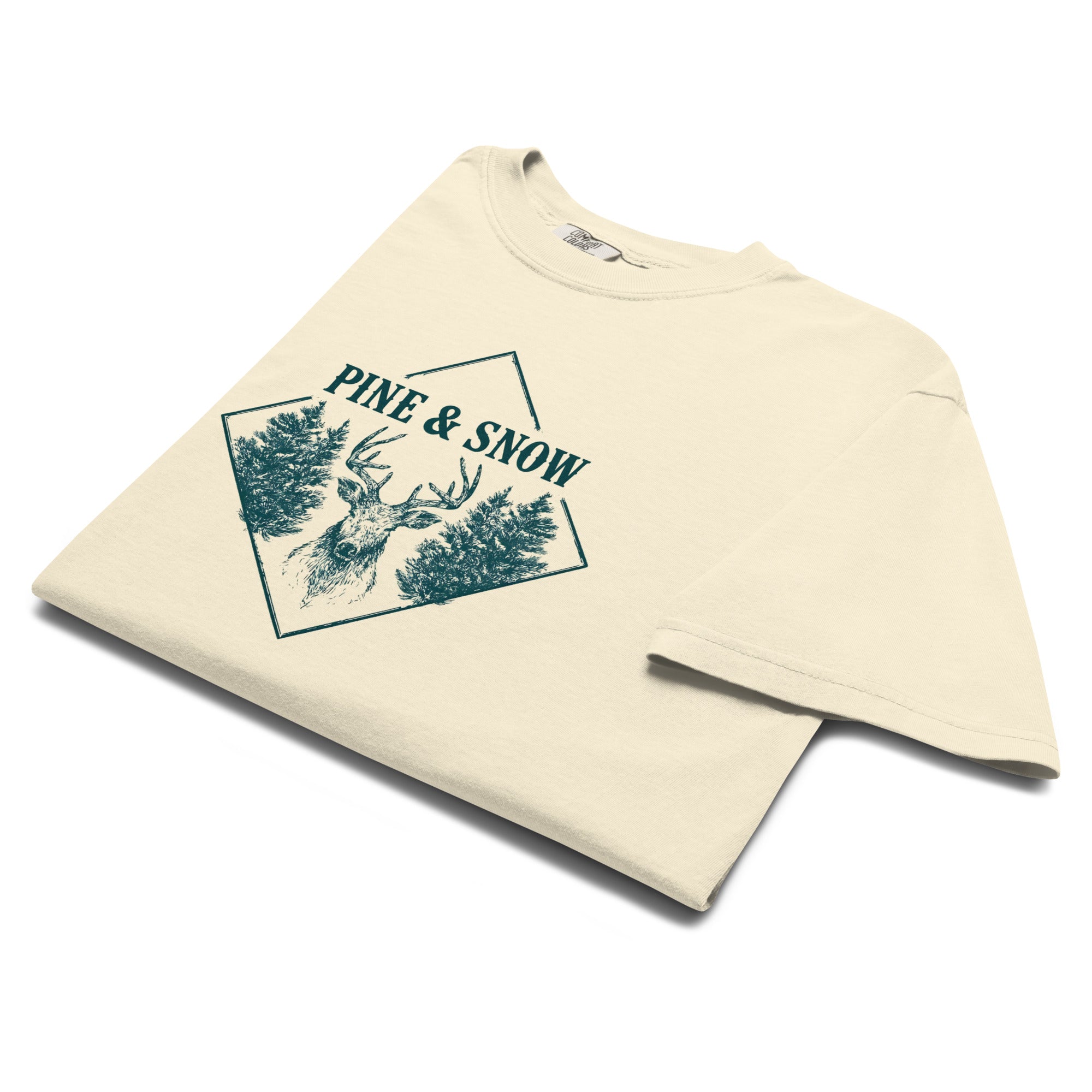 Stag emblem with pine and snow design on an Ivory garment-dyed cotton t-shirt