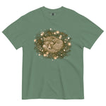 Fox asleep in a Christmas wreath design on a Light Green garment-dyed cotton t-shirt