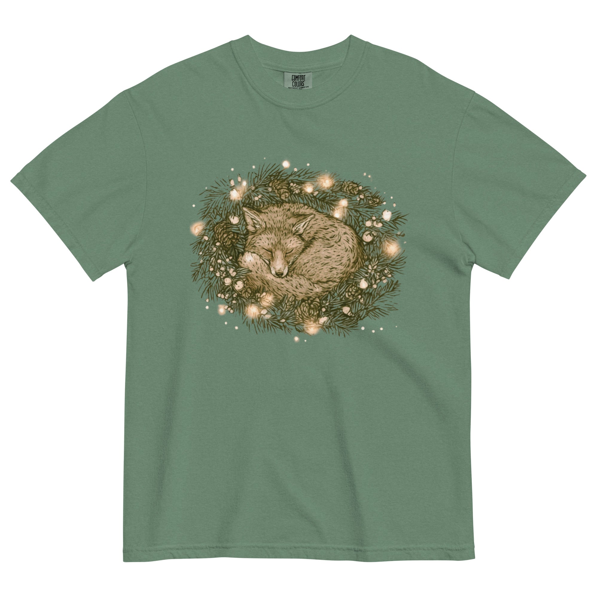 Fox asleep in a Christmas wreath design on a Light Green garment-dyed cotton t-shirt
