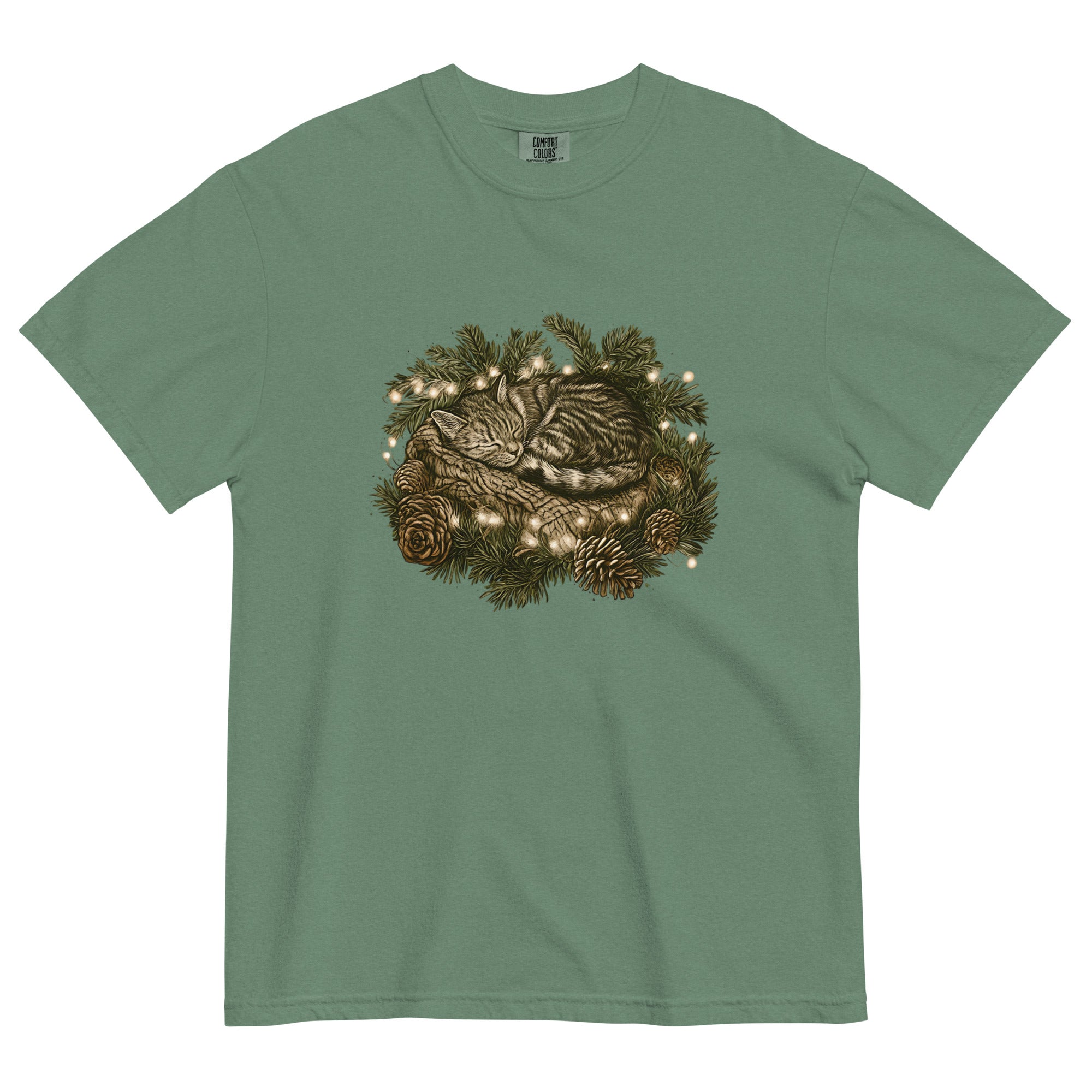 Kitten asleep in a Christmas wreath design on a Light Green garment-dyed cotton t-shirt