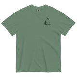 Snowman and pine tree design on a Light Green garment-dyed cotton t-shirt