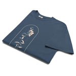 Wildflower and constellation design on a Midnight garment-dyed cotton t-shirt