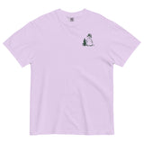 Snowman and pine tree design on an Orchid garment-dyed cotton t-shirt