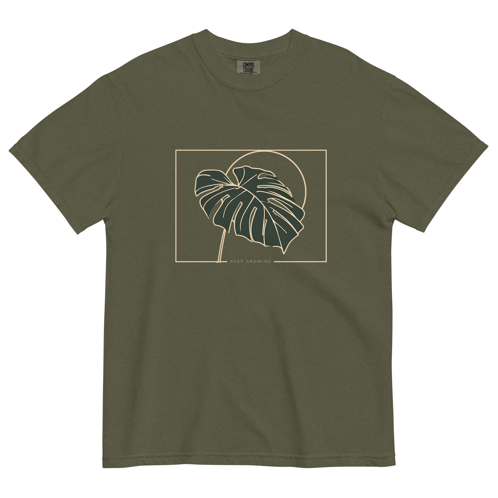 Monstera leaf design on a Sage garment-dyed cotton t-shirt