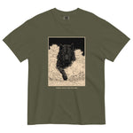Black wolf in deep snow design on a Sage garment-dyed cotton t-shirt