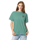 Elf and pine tree design on a Seafoam garment-dyed cotton t-shirt