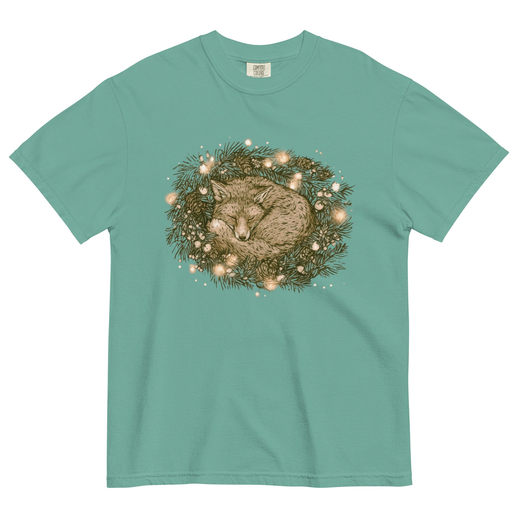 Fox asleep in a Christmas wreath design on a Seafoam garment-dyed cotton t-shirt