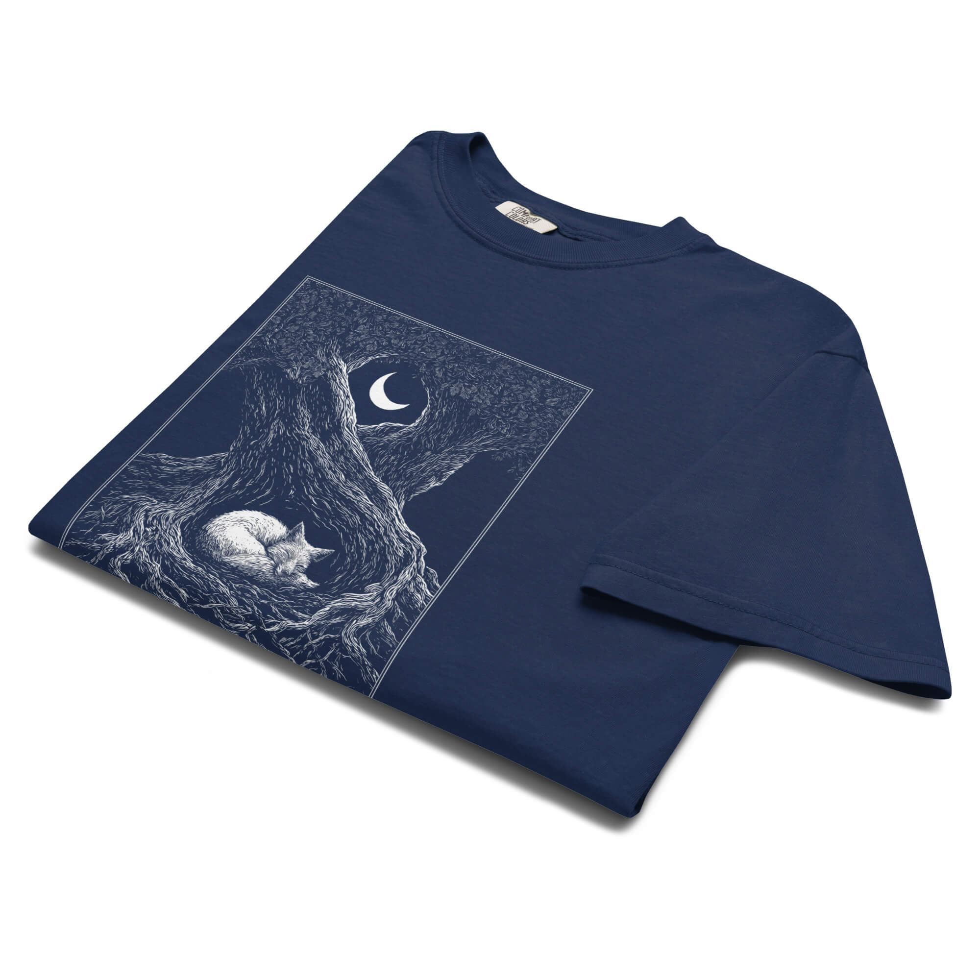 Sleeping fox and ancient tree design on a True Navy garment-dyed cotton t-shirt
