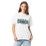 Moose in the winter woods design on a White garment-dyed cotton t-shirt